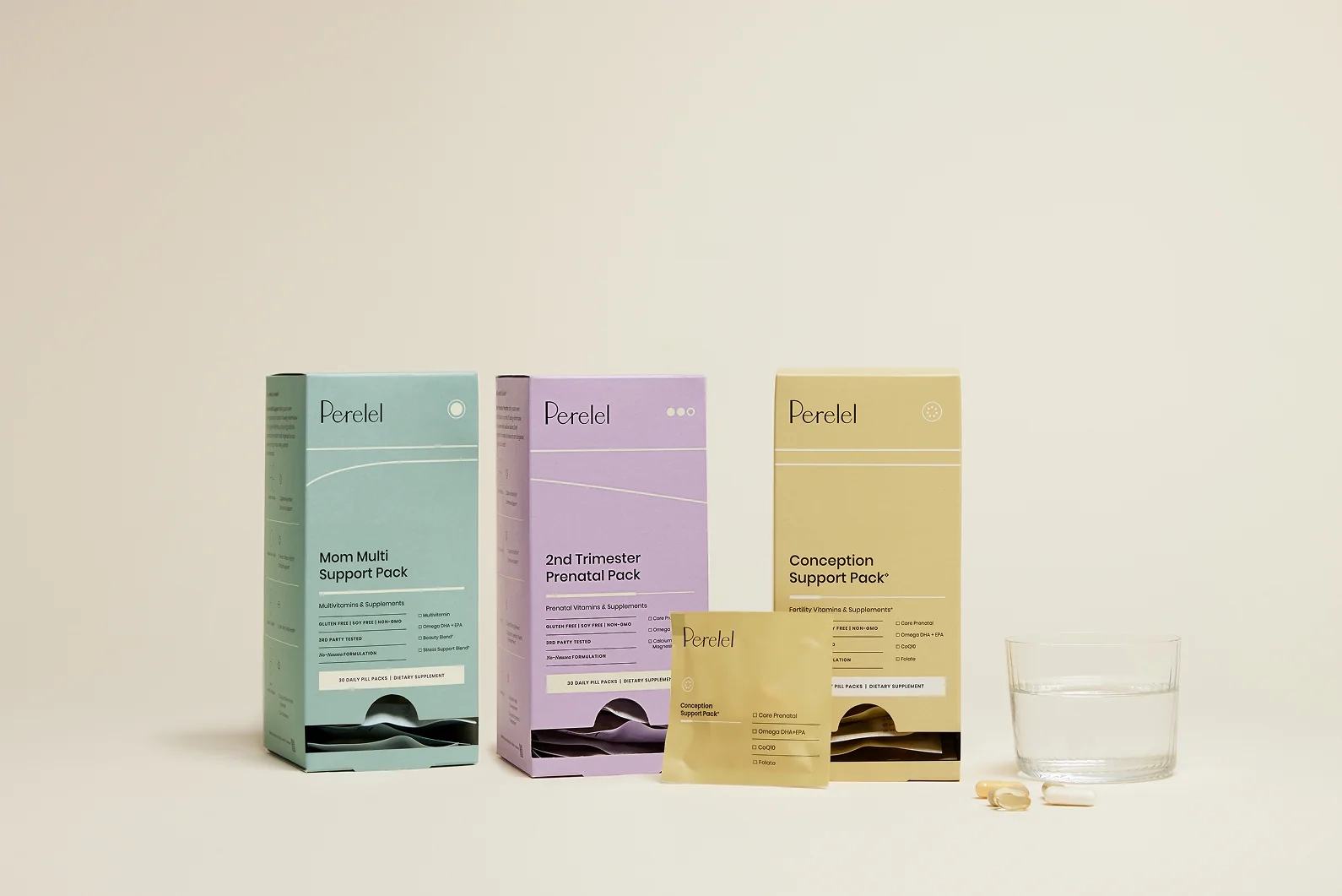 Perelel stage boxes and sachets arranged on a beige background